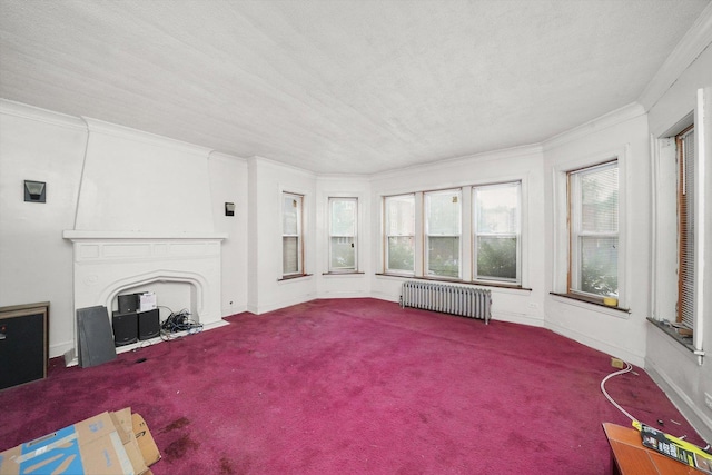 carpeted living room with crown molding, a fireplace, radiator heating unit, a textured ceiling, and baseboards