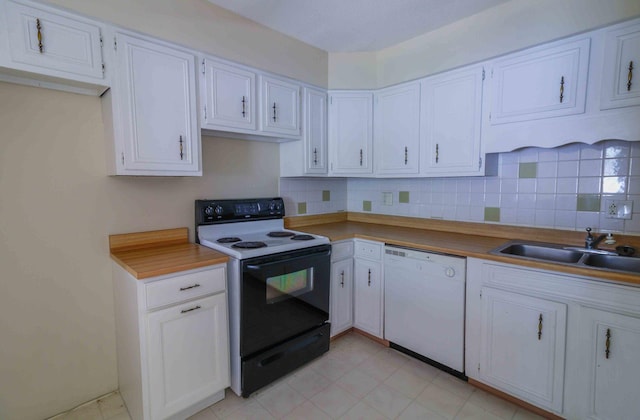 kitchen featuring dishwasher, sink, white cabinets, and black range with electric cooktop