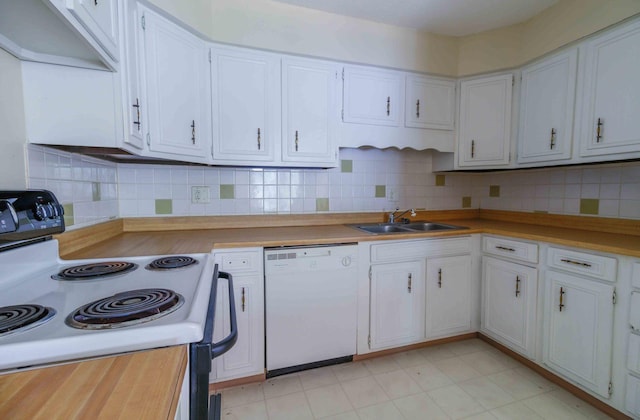 kitchen featuring range with electric cooktop, sink, white cabinets, and white dishwasher