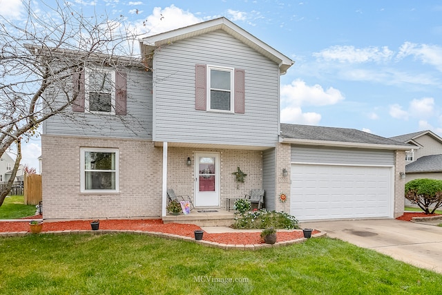 view of property with a garage and a front lawn