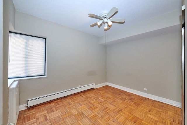 unfurnished room with ceiling fan, light parquet floors, and baseboard heating