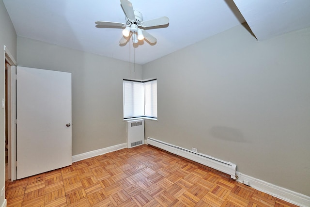 unfurnished room featuring a baseboard radiator, light parquet flooring, and ceiling fan