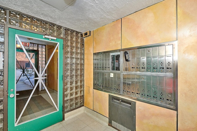 bar featuring tile patterned flooring and a mail area