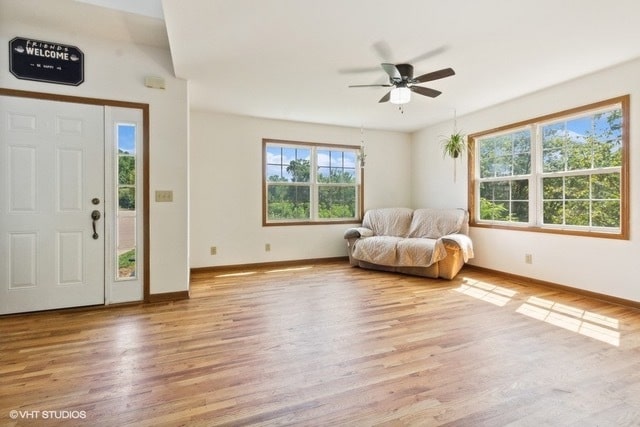 unfurnished room with light hardwood / wood-style floors and ceiling fan