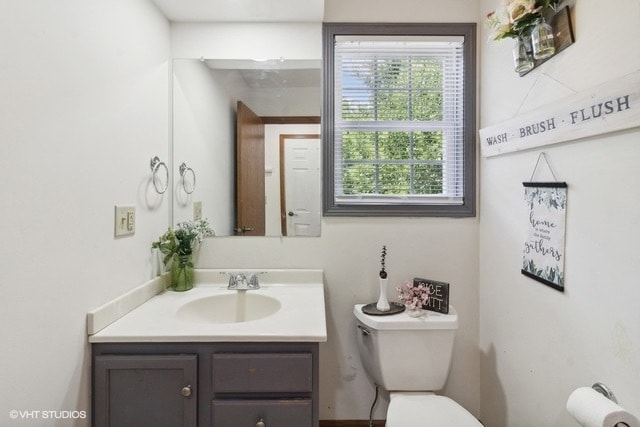 bathroom with vanity and toilet