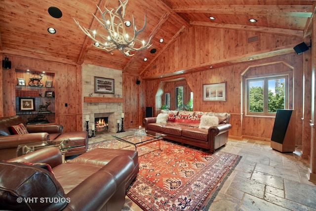 living room featuring wood ceiling, stone tile flooring, wood walls, a fireplace, and high vaulted ceiling