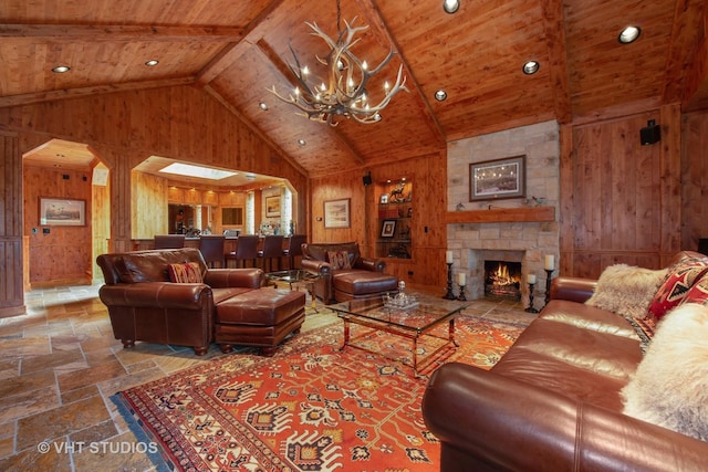 living room featuring wooden ceiling, stone tile floors, wooden walls, and a fireplace