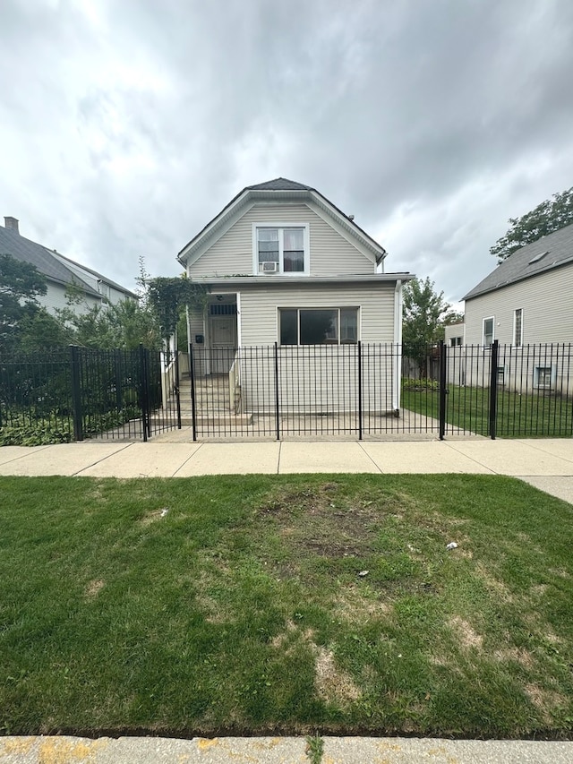 rear view of property with a yard