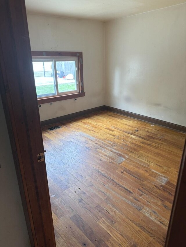 empty room featuring wood-type flooring