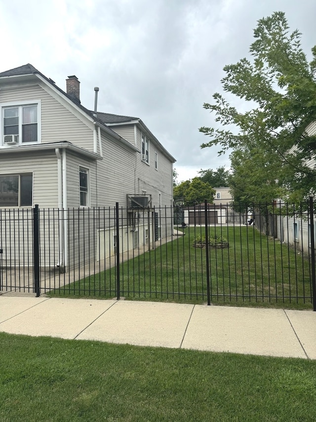 view of property exterior featuring a lawn