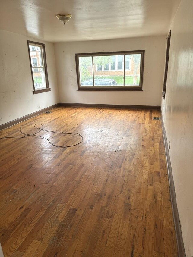 empty room featuring hardwood / wood-style flooring