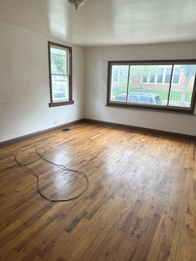 spare room featuring hardwood / wood-style flooring