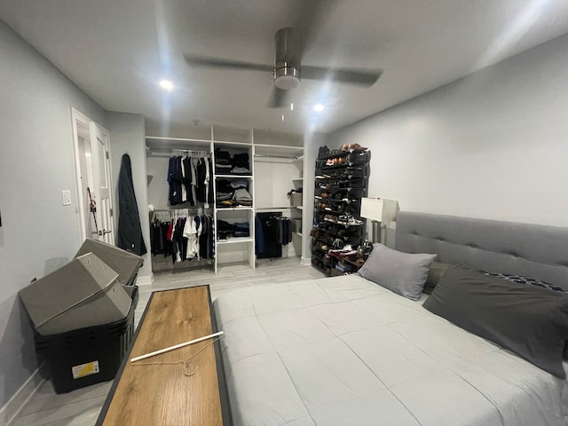 bedroom featuring a closet, ceiling fan, and light hardwood / wood-style flooring