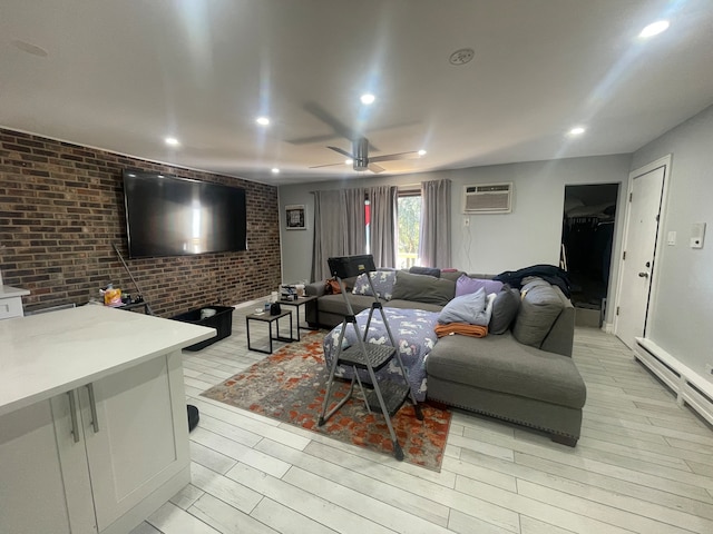 living room featuring light hardwood / wood-style floors, ceiling fan, a baseboard radiator, and brick wall