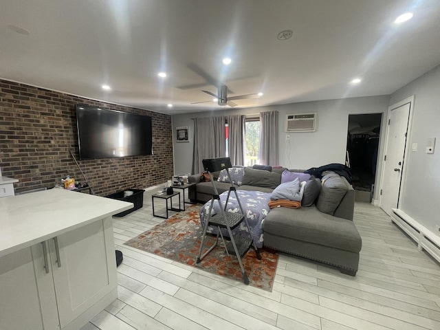living area with brick wall, light wood-style floors, recessed lighting, ceiling fan, and a baseboard radiator