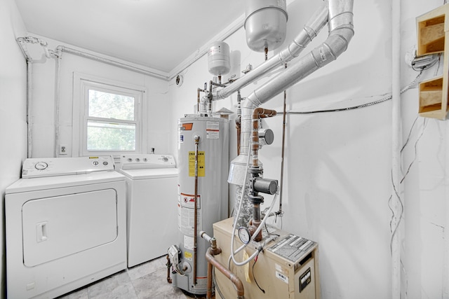 washroom with washing machine and clothes dryer, gas water heater, light tile patterned floors, and ornamental molding