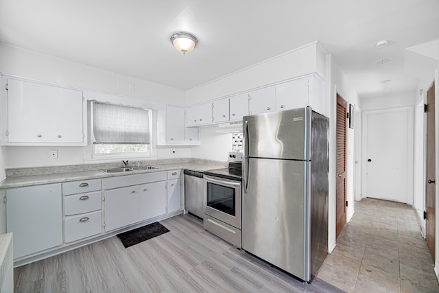 kitchen with light hardwood / wood-style floors, sink, white cabinets, and stainless steel appliances