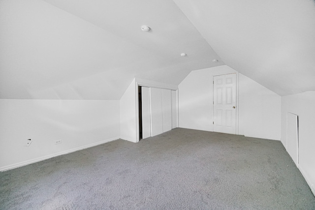 bonus room featuring carpet floors and lofted ceiling