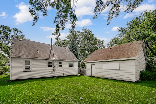 back of property featuring a yard