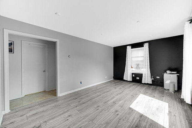 unfurnished living room featuring light hardwood / wood-style flooring