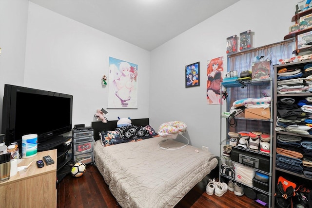 bedroom featuring dark hardwood / wood-style flooring