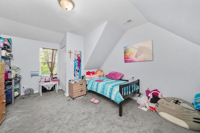 bedroom with carpet floors and vaulted ceiling