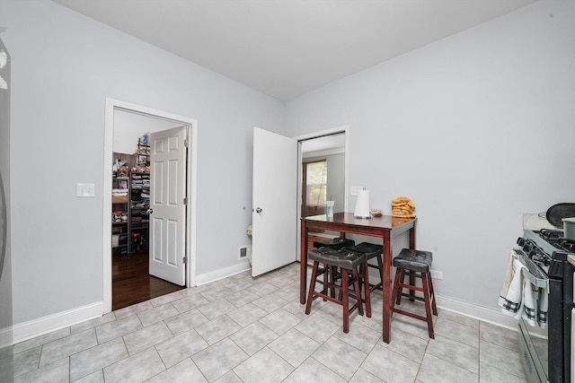 dining room featuring light tile patterned flooring