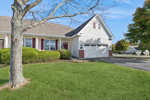 view of front facade with a front lawn and a garage