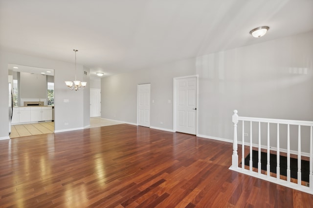 interior space with an inviting chandelier and hardwood / wood-style flooring