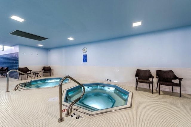 view of pool featuring an indoor hot tub and a swimming pool