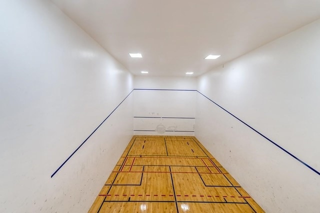 view of home's community with a sport court