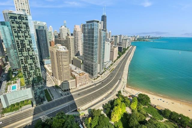 view of city featuring a view of the beach and a water view