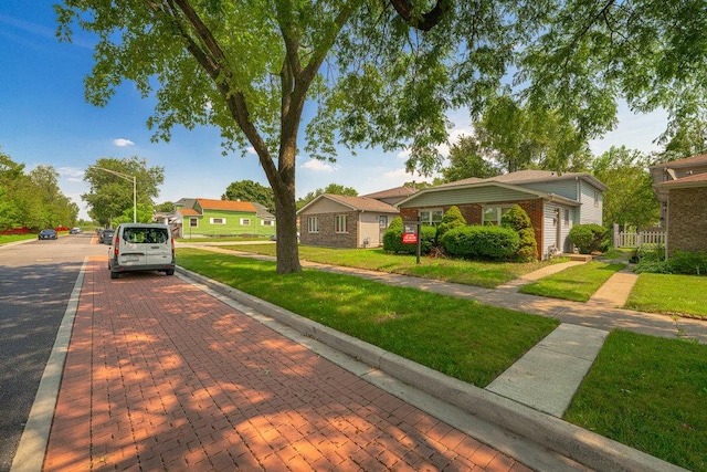 view of home's community featuring a yard