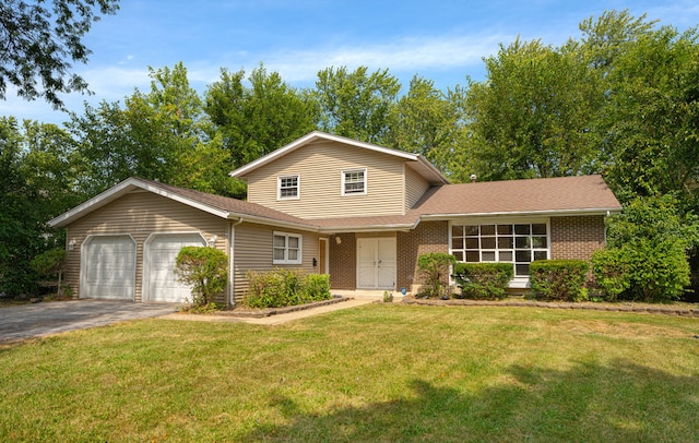 view of front of property featuring a front lawn and a garage