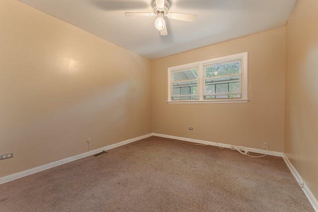 empty room with carpet flooring and ceiling fan