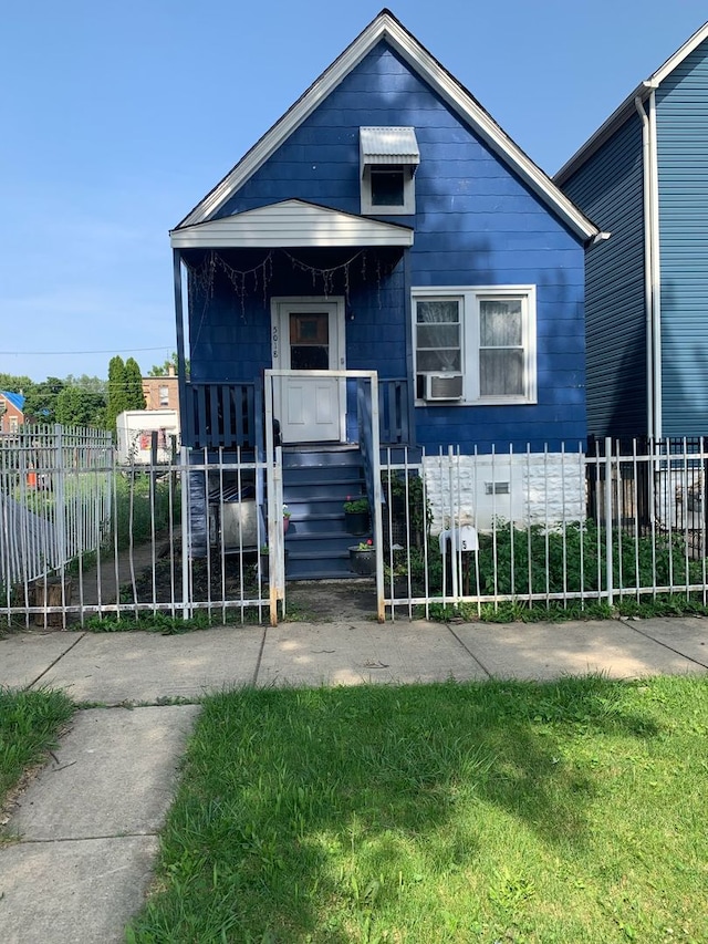 bungalow-style house with cooling unit