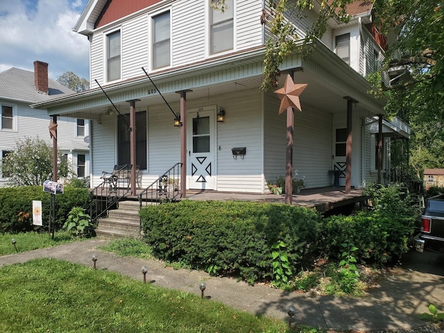 view of front of property featuring covered porch