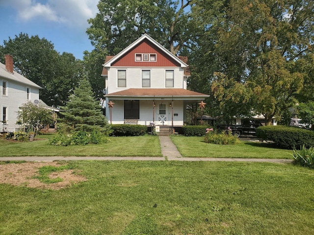 view of front of property featuring a porch and a front yard