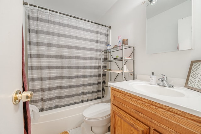 full bathroom featuring toilet, shower / tub combo with curtain, and vanity