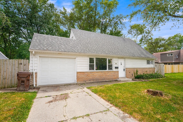 view of front facade with a garage and a front yard