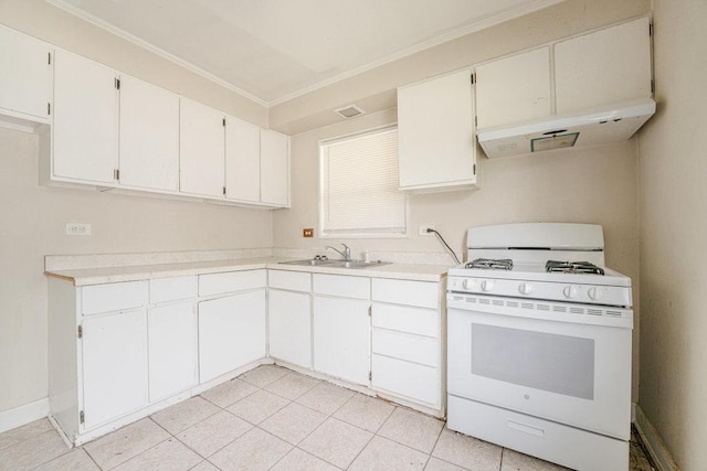 kitchen with ornamental molding, gas range gas stove, light countertops, under cabinet range hood, and a sink