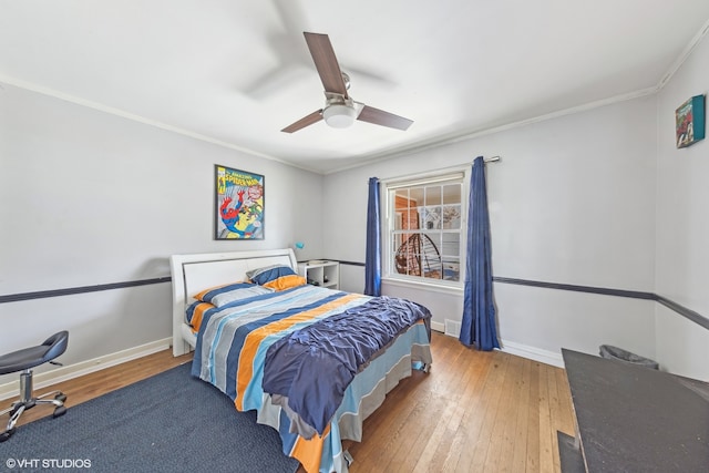 bedroom with ceiling fan, light wood-type flooring, and crown molding