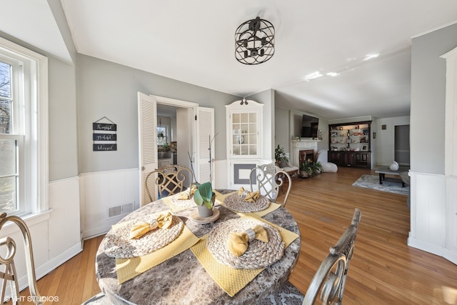 dining area featuring plenty of natural light and light wood-type flooring