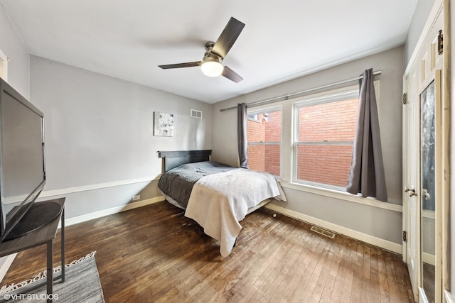 bedroom featuring ceiling fan and hardwood / wood-style flooring