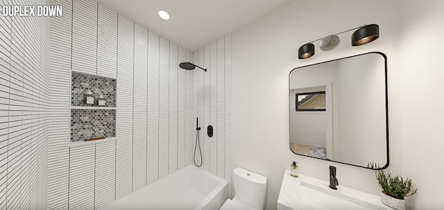 bathroom featuring vanity, toilet, and a tile shower