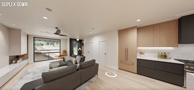 living room with ceiling fan, light wood-type flooring, and a multi sided fireplace