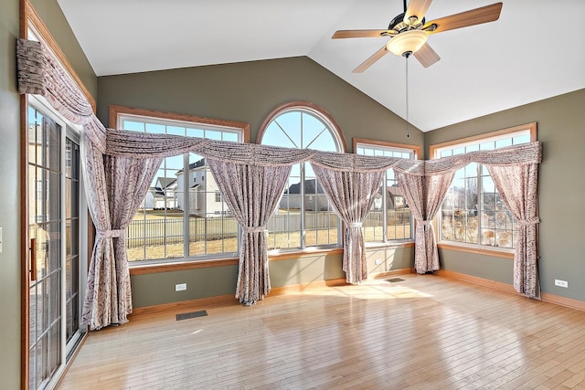 unfurnished sunroom with lofted ceiling and ceiling fan