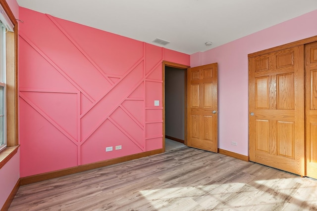 unfurnished bedroom featuring light hardwood / wood-style floors