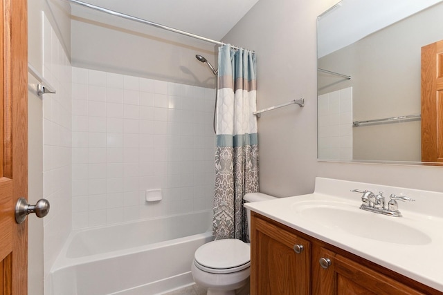 full bathroom featuring vanity, shower / tub combo with curtain, and toilet