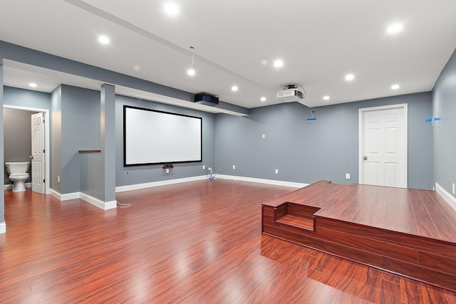 cinema room with hardwood / wood-style floors